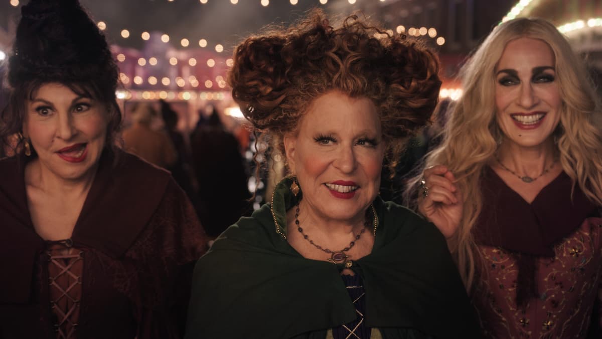 (L-R): Kathy Najimy as Mary Sanderson, Bette Midler as Winifred Sanderson, and Sarah Jessica Parker as Sarah Sanderson in Disney's live-action HOCUS POCUS 2, exclusively on Disney+. Photo courtesy of Disney Enterprises, Inc. © 2022 Disney Enterprises, Inc. All Rights Reserved.