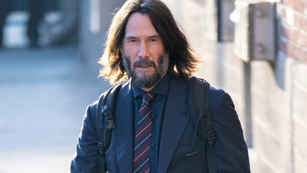 keanu-reeves suit tie backpack