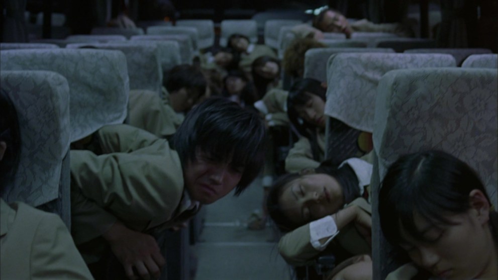 A group of students passed out on a bus.